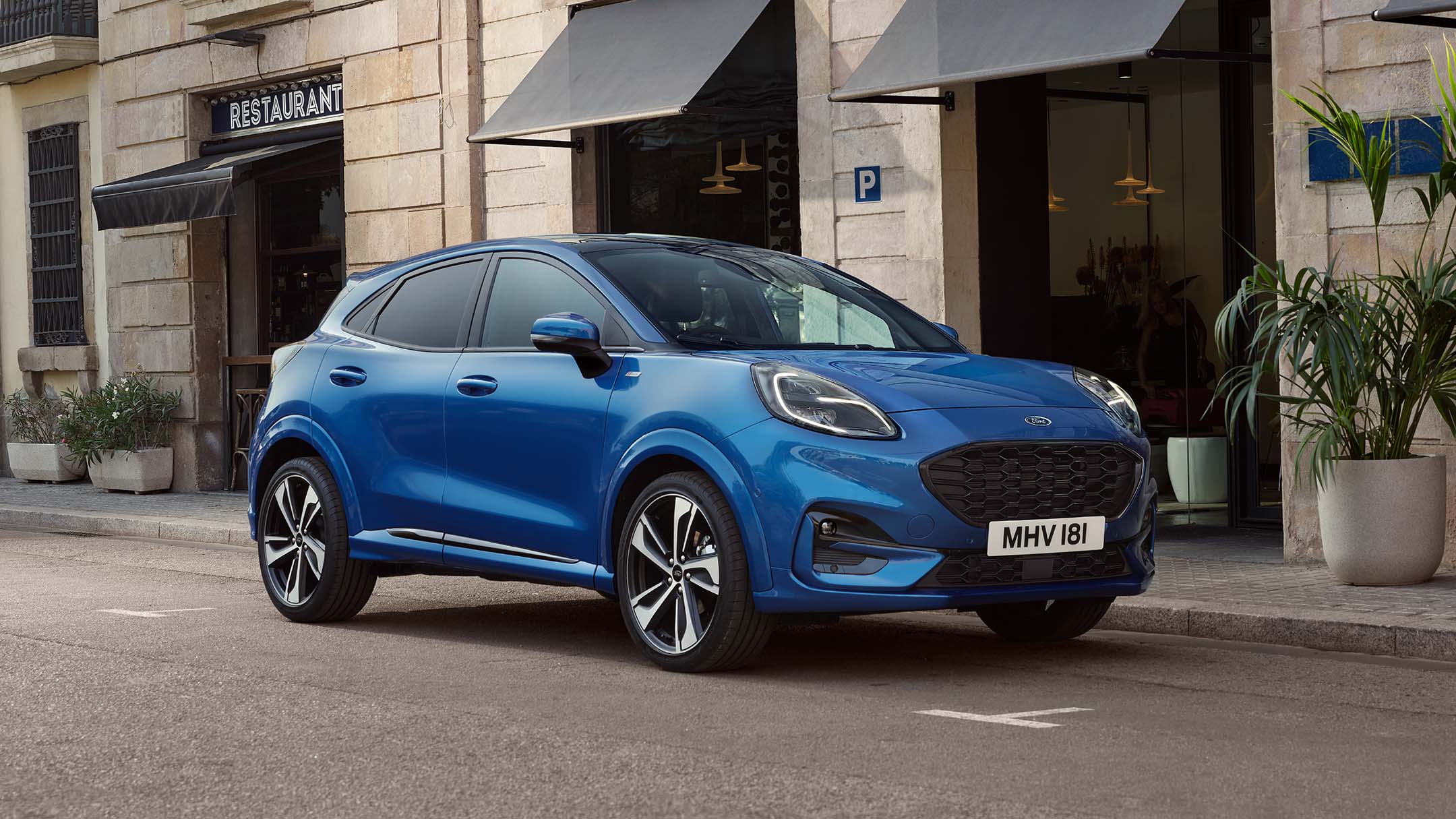 Blue Ford Puma mild hybrid car parked